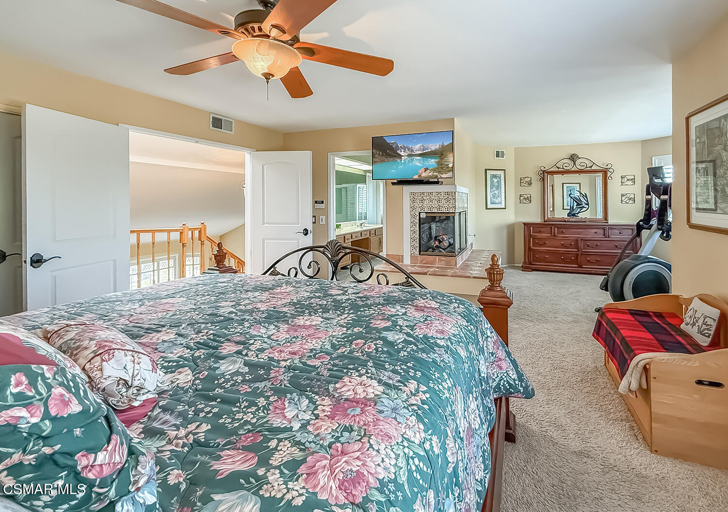 13749 Gunsmoke Road Moorpark, CA 93021 - Photo 46 of 61 a bedroom with bed and a chandelier