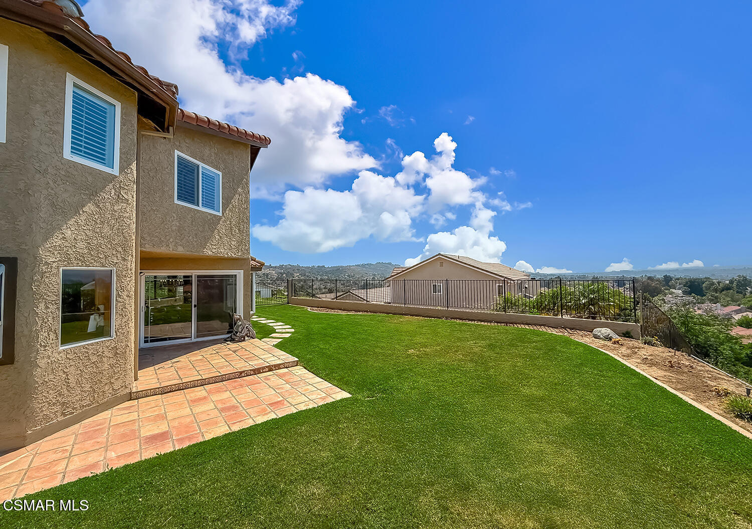 13749 Gunsmoke Road Moorpark, CA 93021 - Photo 55 of 61 a view of a house with a yard