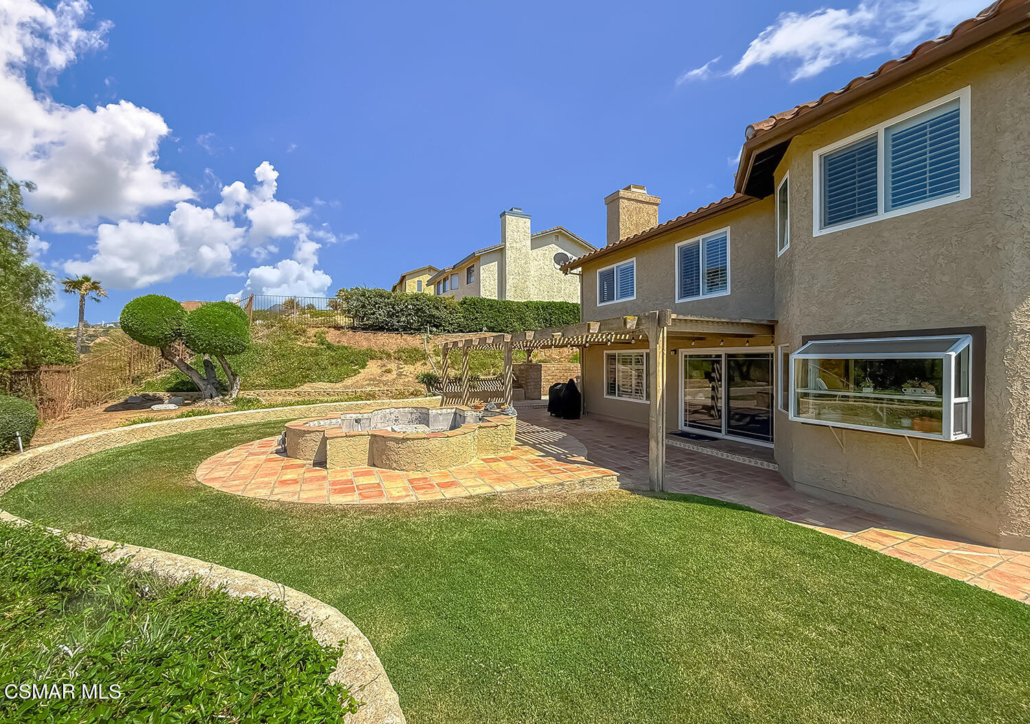 13749 Gunsmoke Road Moorpark, CA 93021 - Photo 56 of 61 a front view of a house with a yard table and chairs