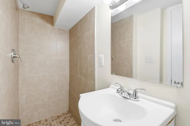 a view of a backyard with wooden fence