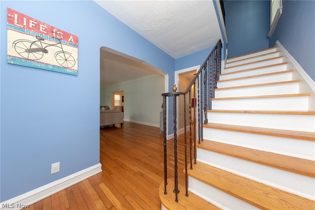 3329 Chalfant Road Cleveland, OH 44120 - Photo 15 of 33 The natural wood staircase with wrought iron railings leading to the sleeping quarters