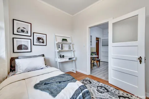 a bedroom with a bed and the cabinets