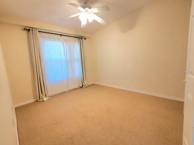 an empty room with fan
