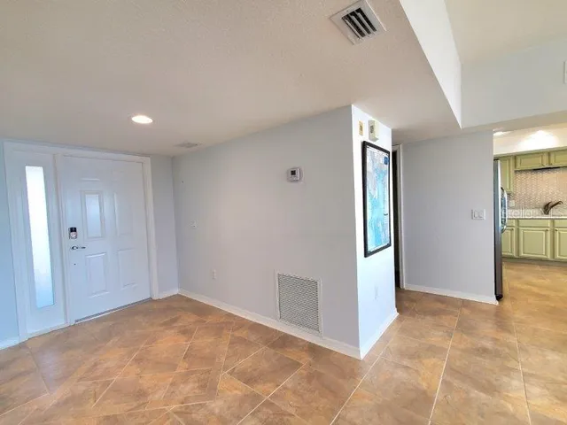 a view of a room with furniture and window