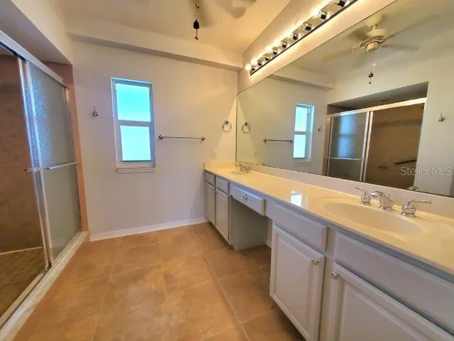 a bedroom with bed and window