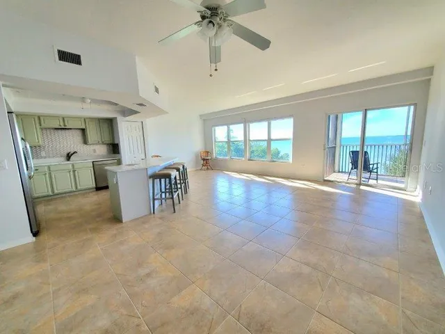 a kitchen with a sink stainless steel appliances and cabinets