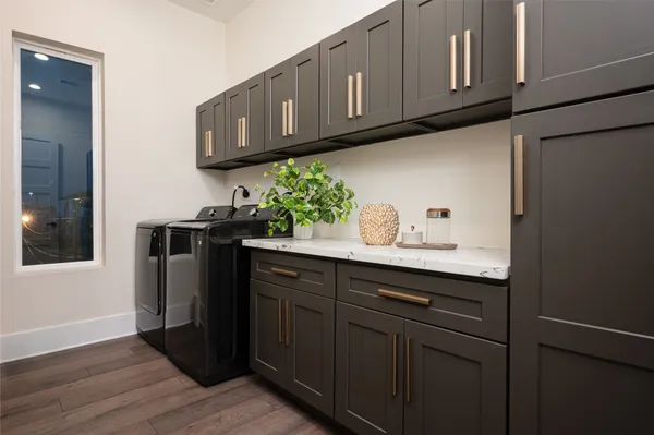 a kitchen with stainless steel appliances granite countertop wooden cabinets and sink
