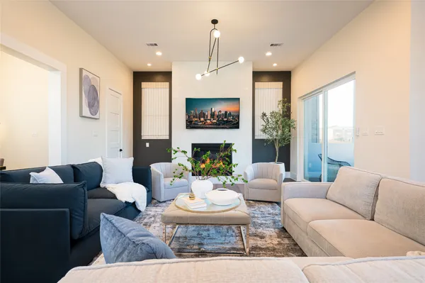 a living room with furniture and a large window