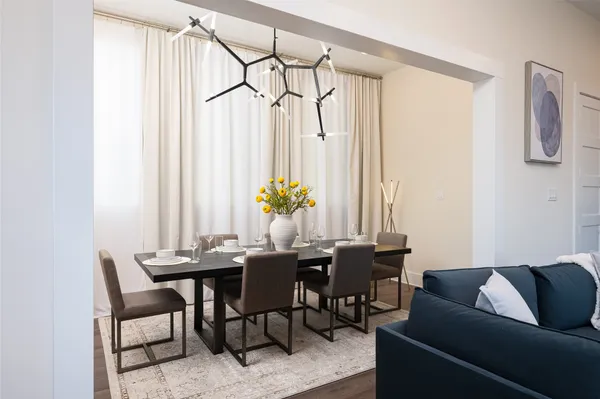 a view of a dining room with furniture and a window