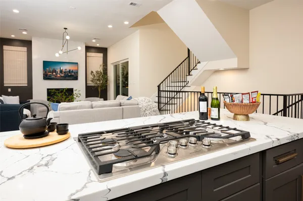 a kitchen with a stove and a refrigerator