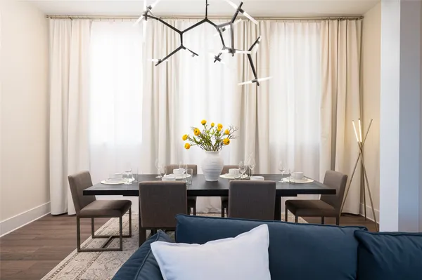 a dining room with furniture and a window