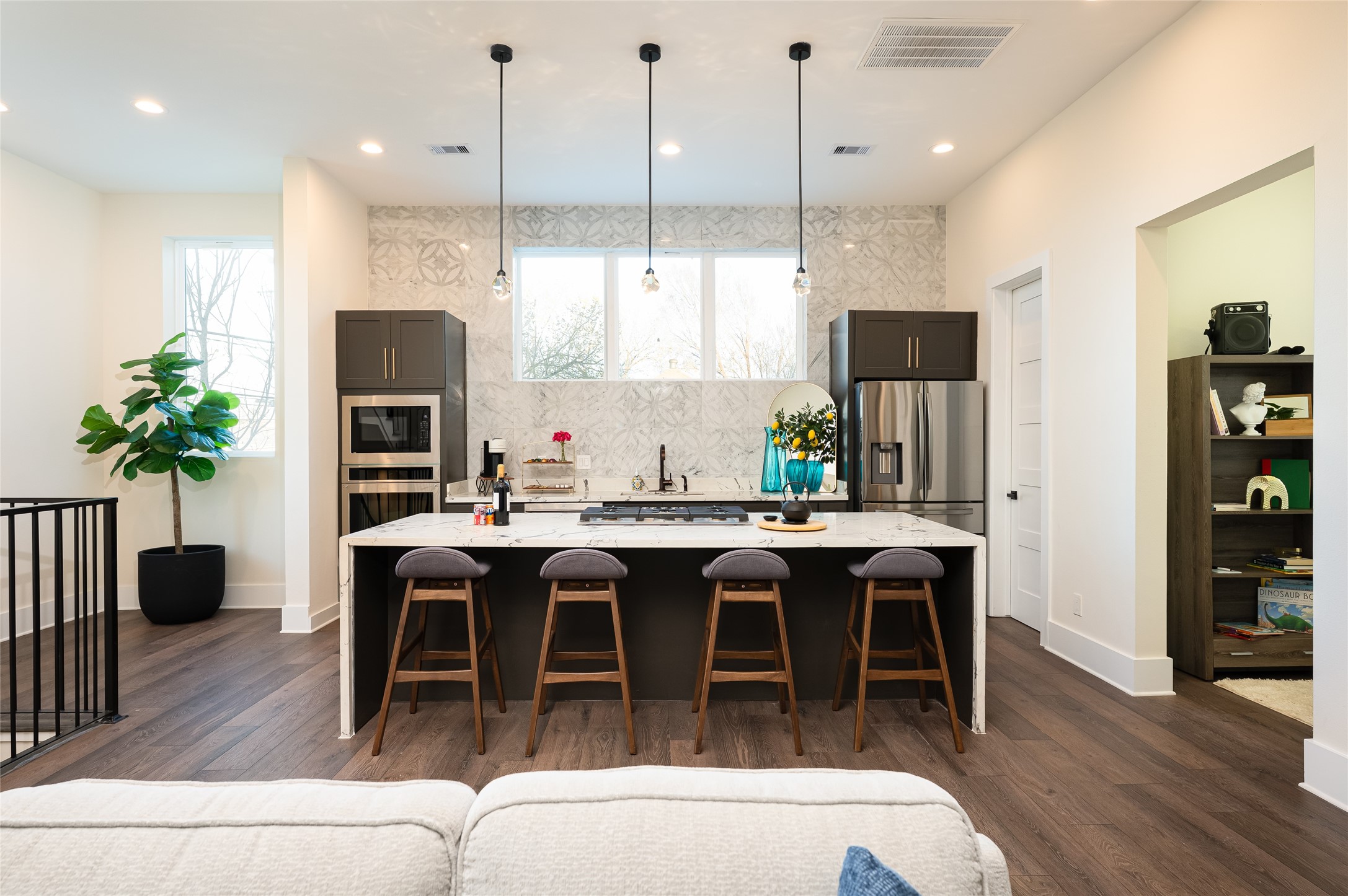 917 Thompson Street Houston, TX 77007 - Photo 10 of 48 a dining table with stainless steel appliances kitchen island granite countertop a table chairs and a kitchen view