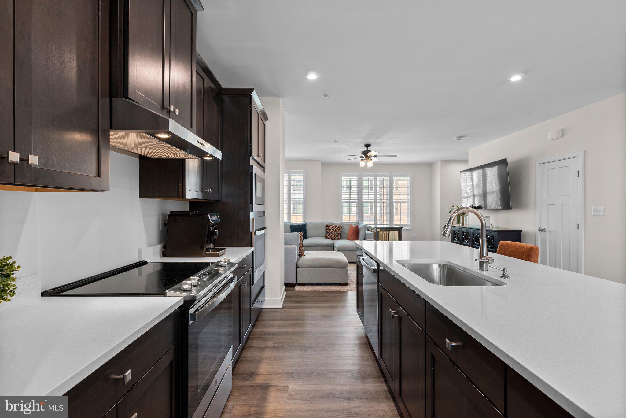 7318 Isabella Road Laurel, MD 20723 - Photo 13 of 39 a kitchen with counter top space cabinets and stainless steel appliances