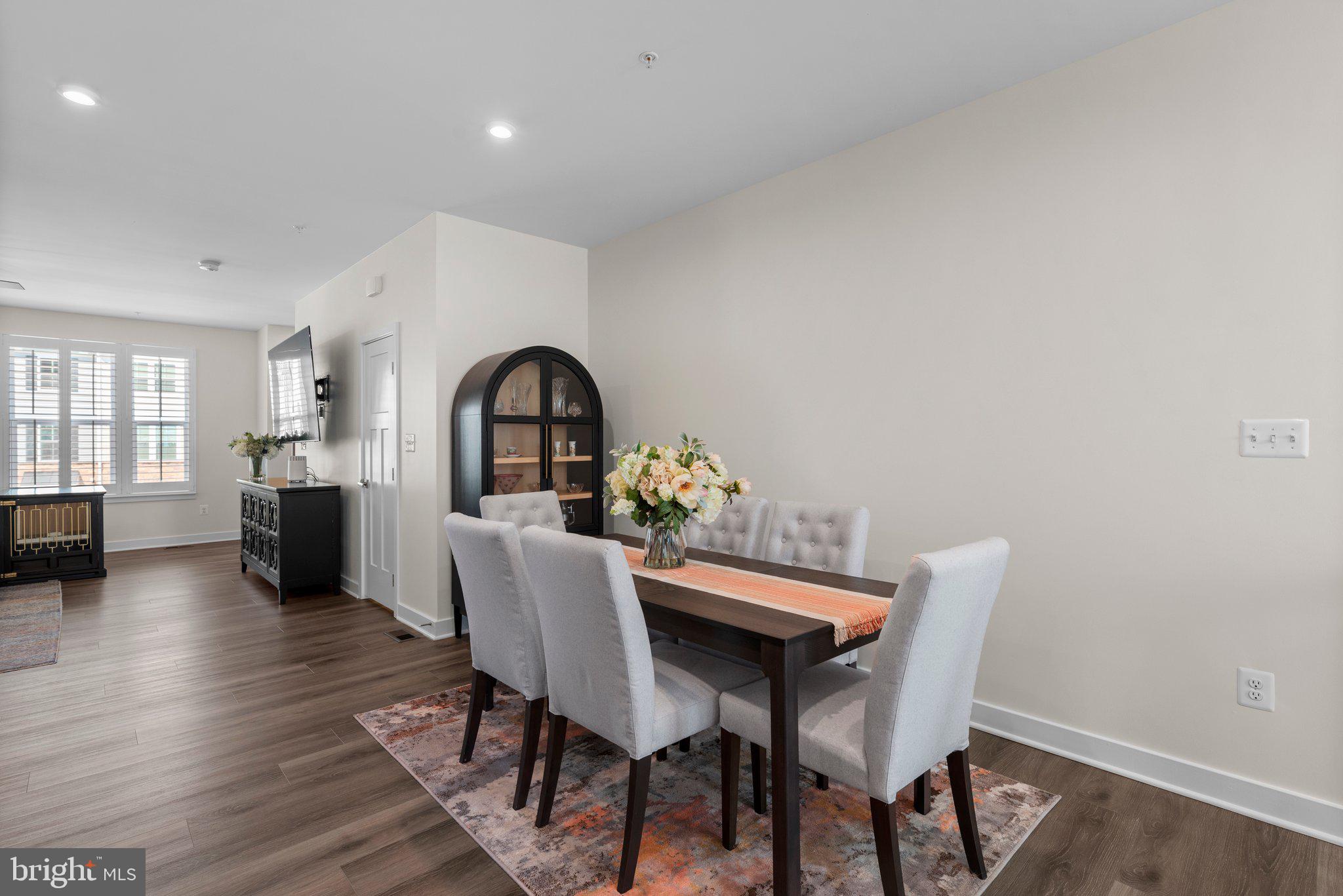 7318 Isabella Road Laurel, MD 20723 - Photo 15 of 39 a view of a dining room with furniture and window