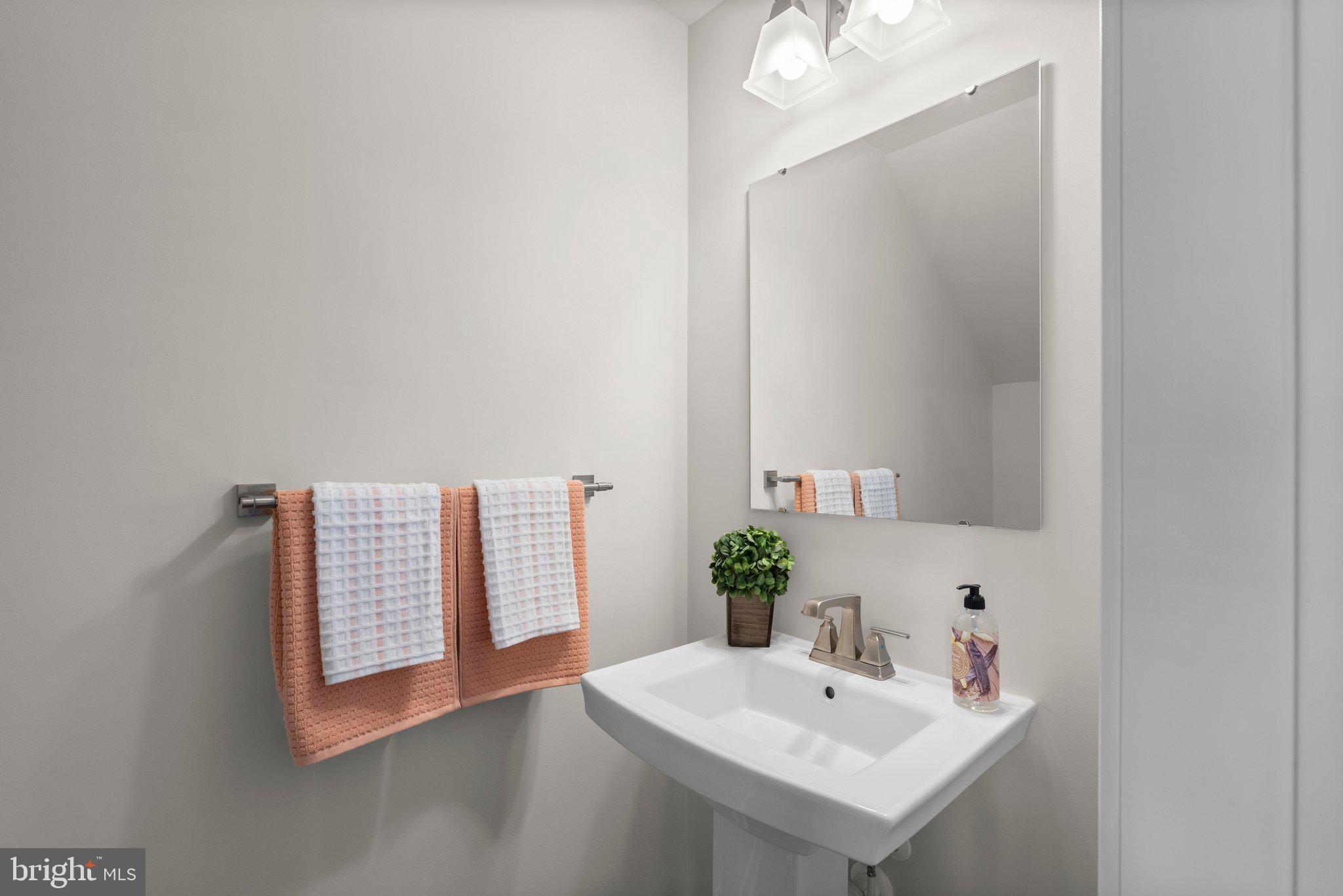 7318 Isabella Road Laurel, MD 20723 - Photo 17 of 39 a bathroom with a sink and a mirror