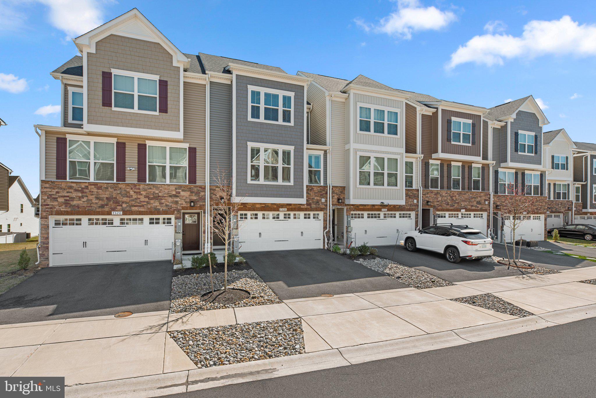 7318 Isabella Road Laurel, MD 20723 - Photo 2 of 39 a front view of a building with lot of windows