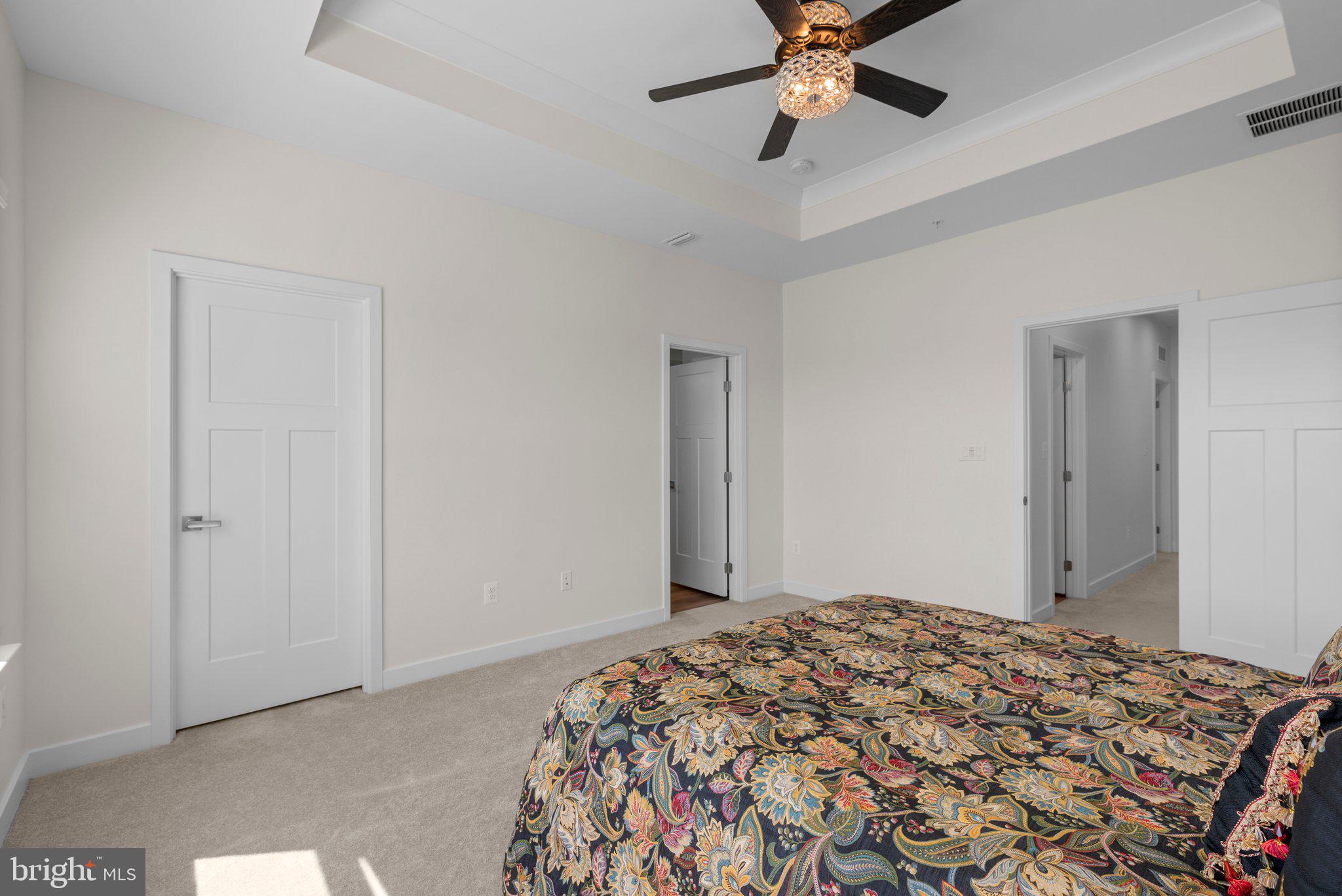 7318 Isabella Road Laurel, MD 20723 - Photo 22 of 39 a bedroom with a bed and a chandelier