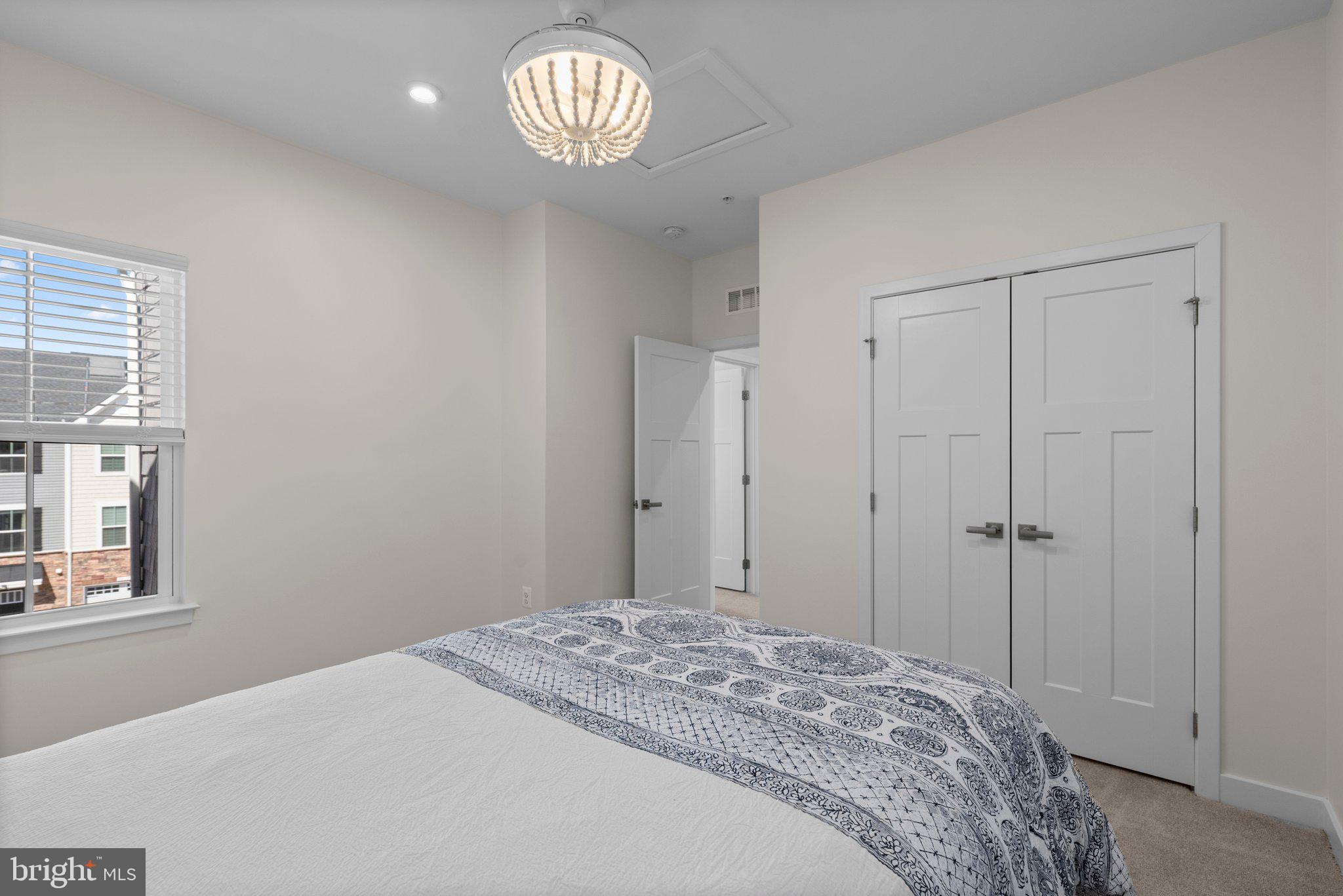 7318 Isabella Road Laurel, MD 20723 - Photo 25 of 39 a bedroom with a bed and a window