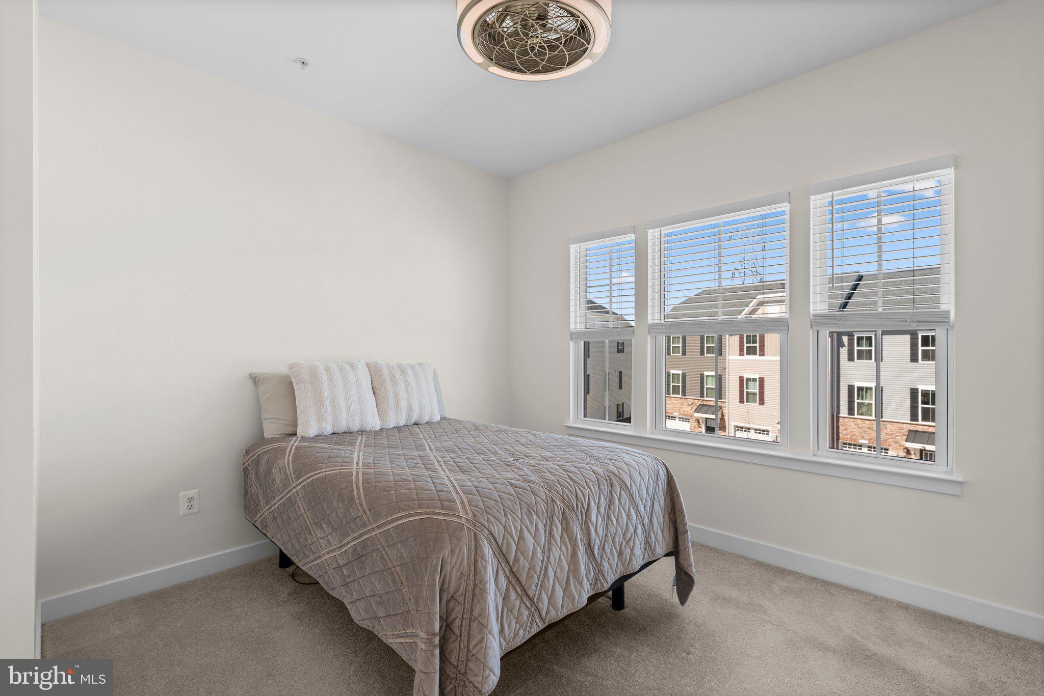 7318 Isabella Road Laurel, MD 20723 - Photo 26 of 39 a bedroom with a bed and a window