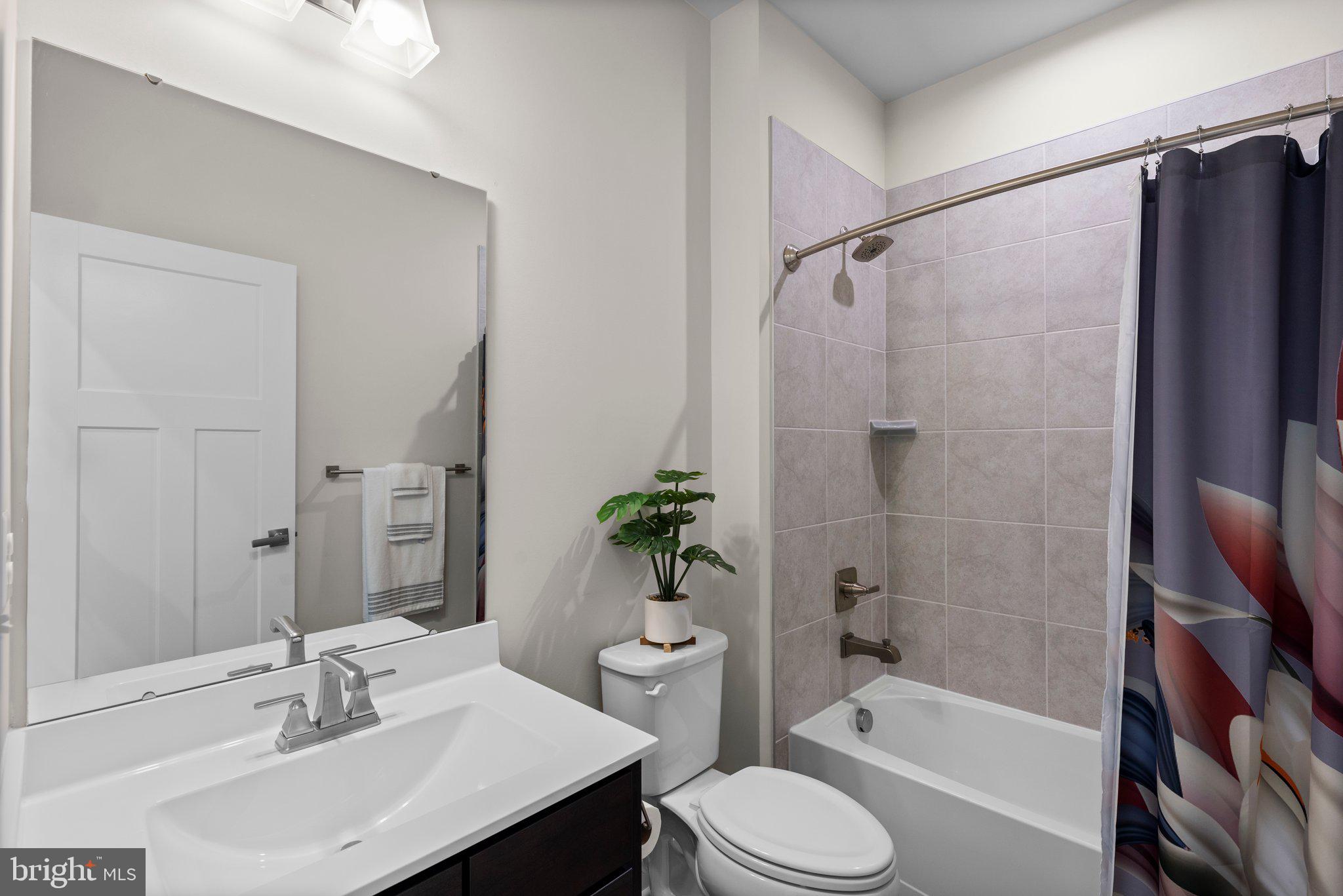 7318 Isabella Road Laurel, MD 20723 - Photo 28 of 39 a bathroom with a sink toilet and shower