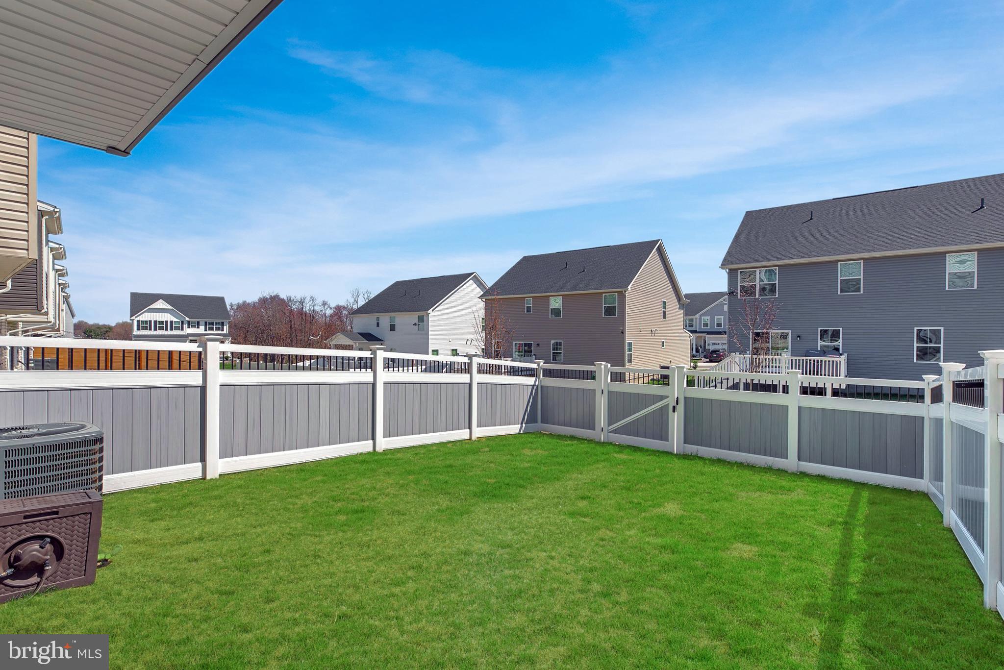 7318 Isabella Road Laurel, MD 20723 - Photo 30 of 39 a view of a backyard with a small pool and wooden fence