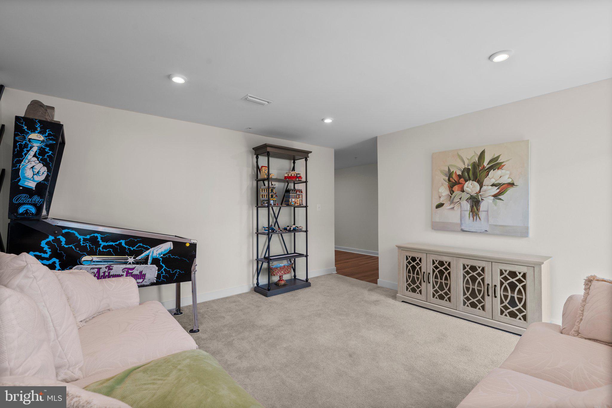 7318 Isabella Road Laurel, MD 20723 - Photo 5 of 39 a living room with furniture and book shelf
