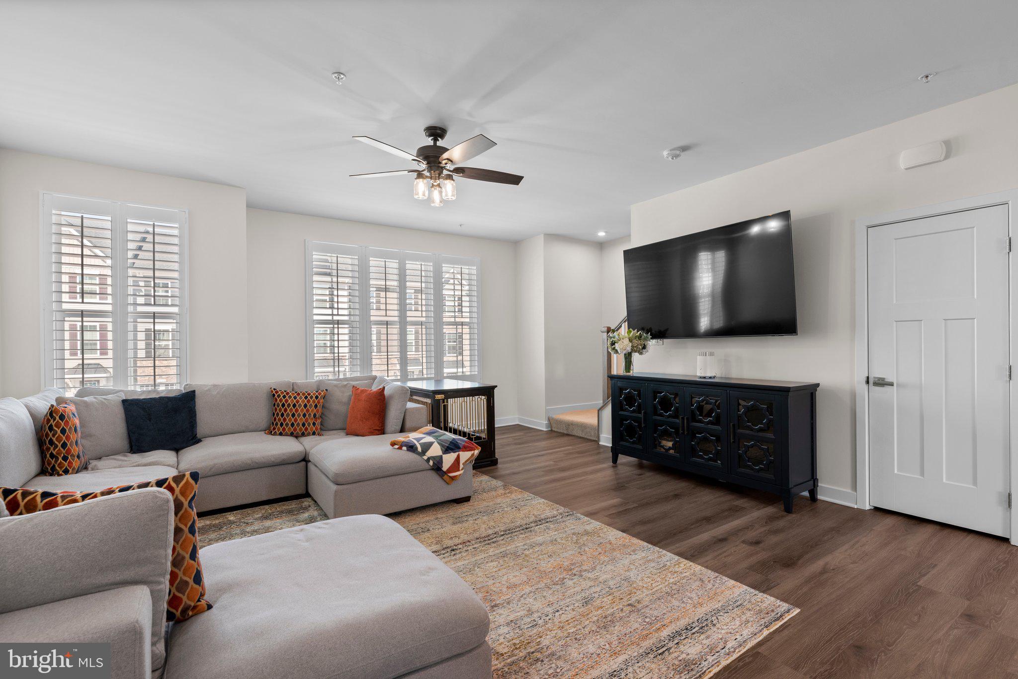 7318 Isabella Road Laurel, MD 20723 - Photo 9 of 39 a living room with furniture and a flat screen tv