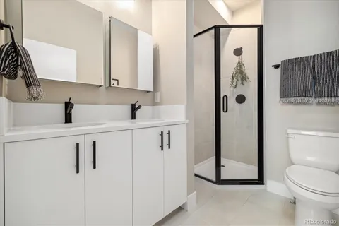 a view of a balcony with wooden floor and fence