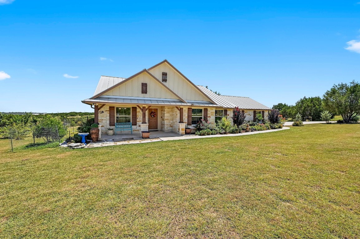 560 Saddle Ridge Drive Bertram, TX 78605 - Photo 1 of 27 a view of a house with a swimming pool