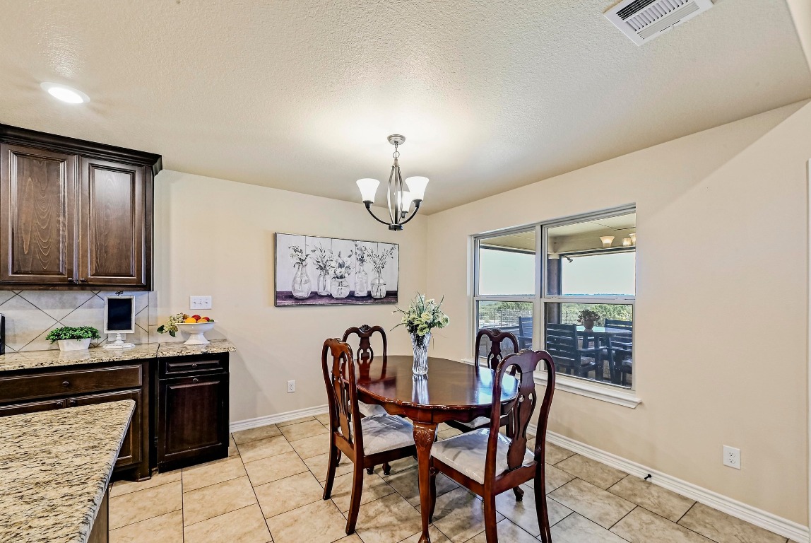 560 Saddle Ridge Drive Bertram, TX 78605 - Photo 10 of 27 a dining room with furniture and window