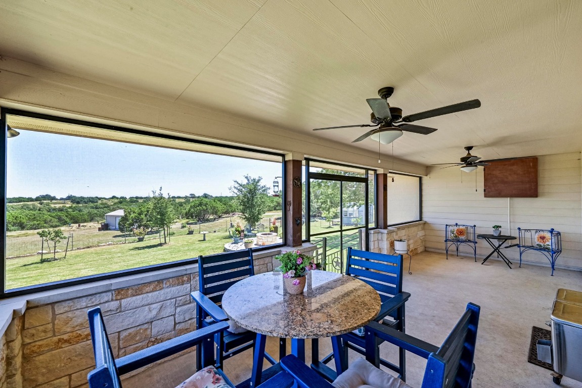 560 Saddle Ridge Drive Bertram, TX 78605 - Photo 18 of 27 a living room with furniture and a large window