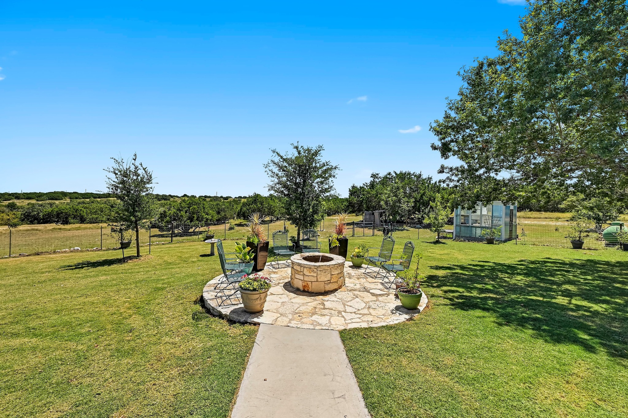 560 Saddle Ridge Drive Bertram, TX 78605 - Photo 19 of 27 a view of a lake with a table and chair