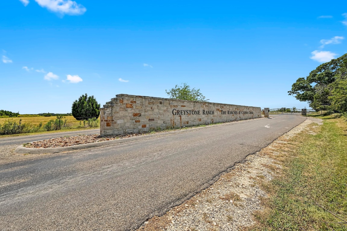 560 Saddle Ridge Drive Bertram, TX 78605 - Photo 2 of 27 a view of a road with an ocean view