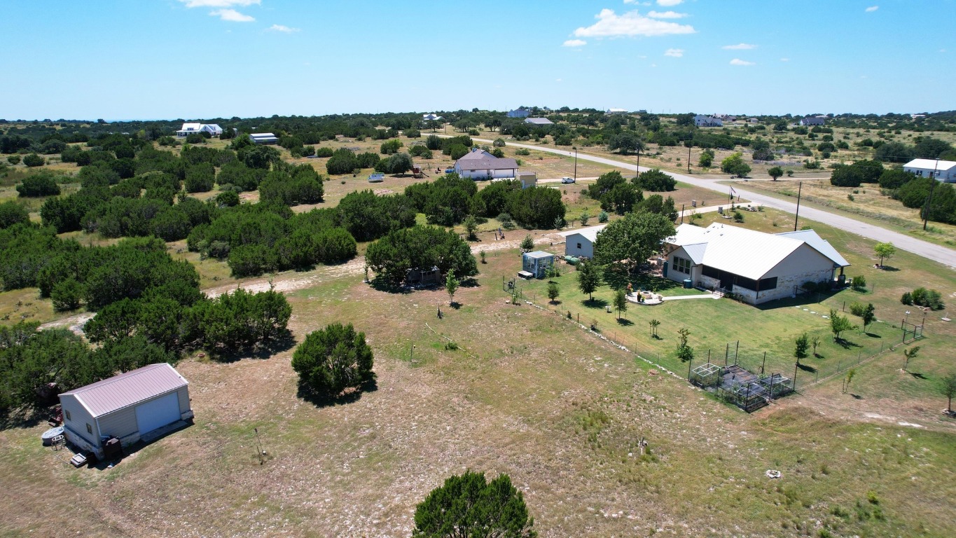 560 Saddle Ridge Drive Bertram, TX 78605 - Photo 25 of 27 an aerial view of a house with a garden