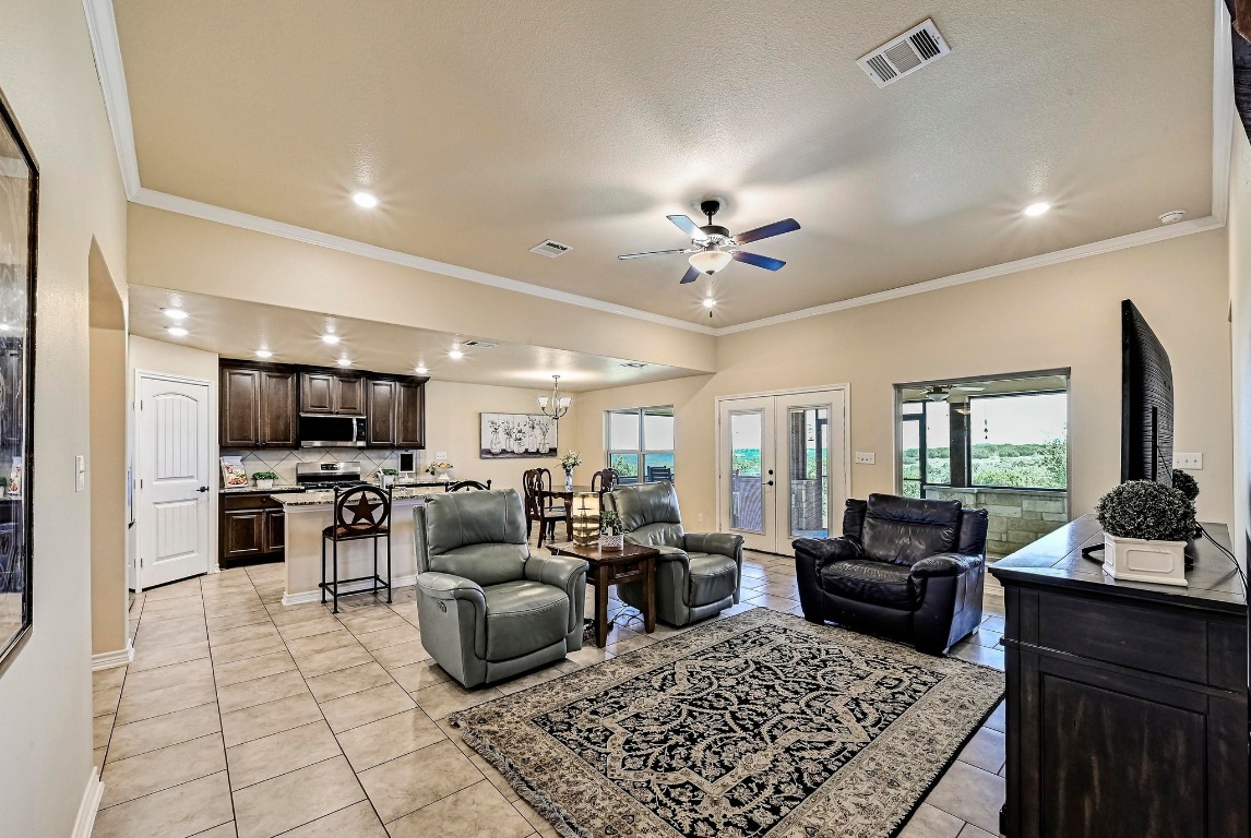 560 Saddle Ridge Drive Bertram, TX 78605 - Photo 8 of 27 a living room with furniture and a flat screen tv
