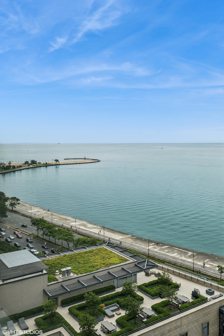 1313 North Ritchie Court, Unit 2106 Chicago, IL 60610 - Photo 4 of 12 a view of a lake with a yard