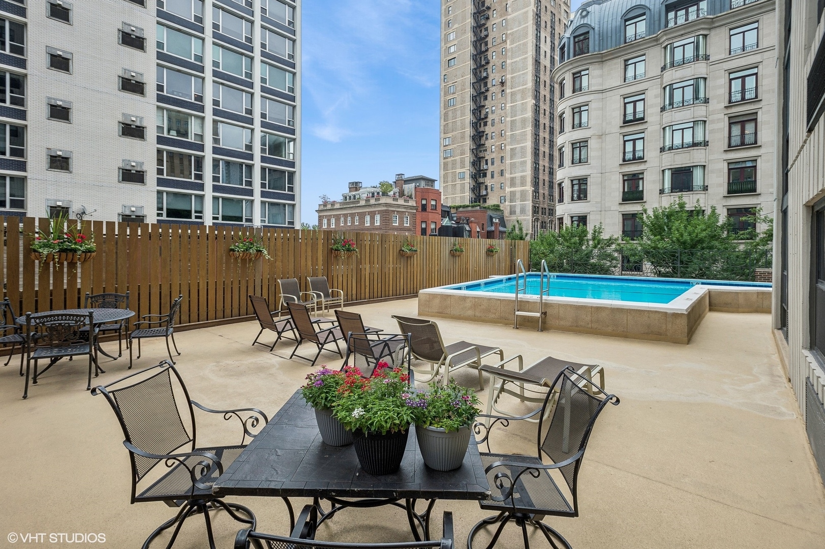 1313 North Ritchie Court, Unit 2106 Chicago, IL 60610 - Photo 8 of 12 a view of a swimming pool with outdoor seating and plants