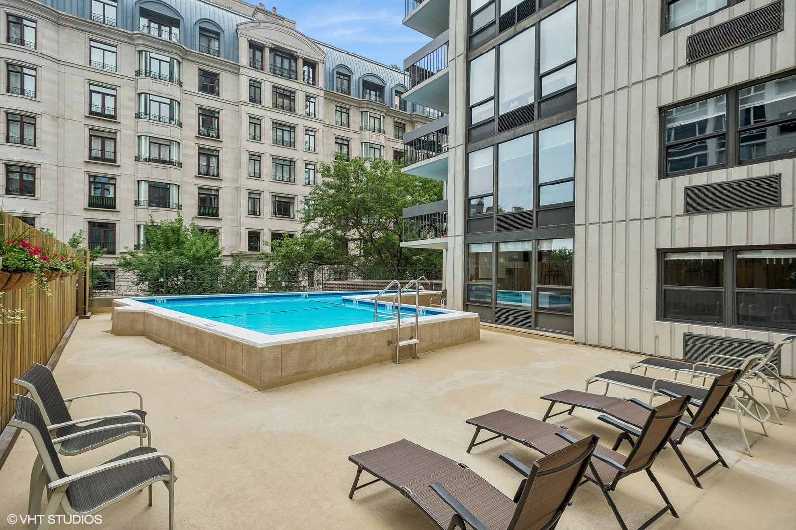 1313 North Ritchie Court, Unit 2106 Chicago, IL 60610 - Photo 9 of 12 a view of a building with a swimming pool and sitting area