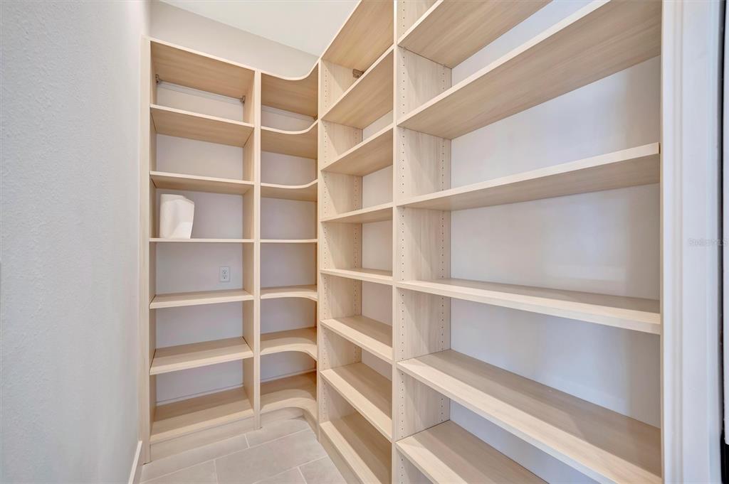5939 Redbay Boulevard Bradenton, FL 34210 - Photo 18 of 61 a view of walk in closet with empty racks