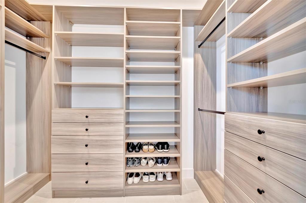 5939 Redbay Boulevard Bradenton, FL 34210 - Photo 41 of 61 a view of walk in closet with clothes and shoes