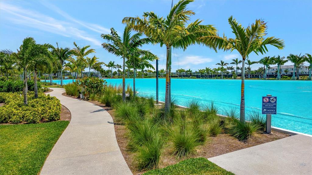 5939 Redbay Boulevard Bradenton, FL 34210 - Photo 54 of 61 a view of a lake with a garden