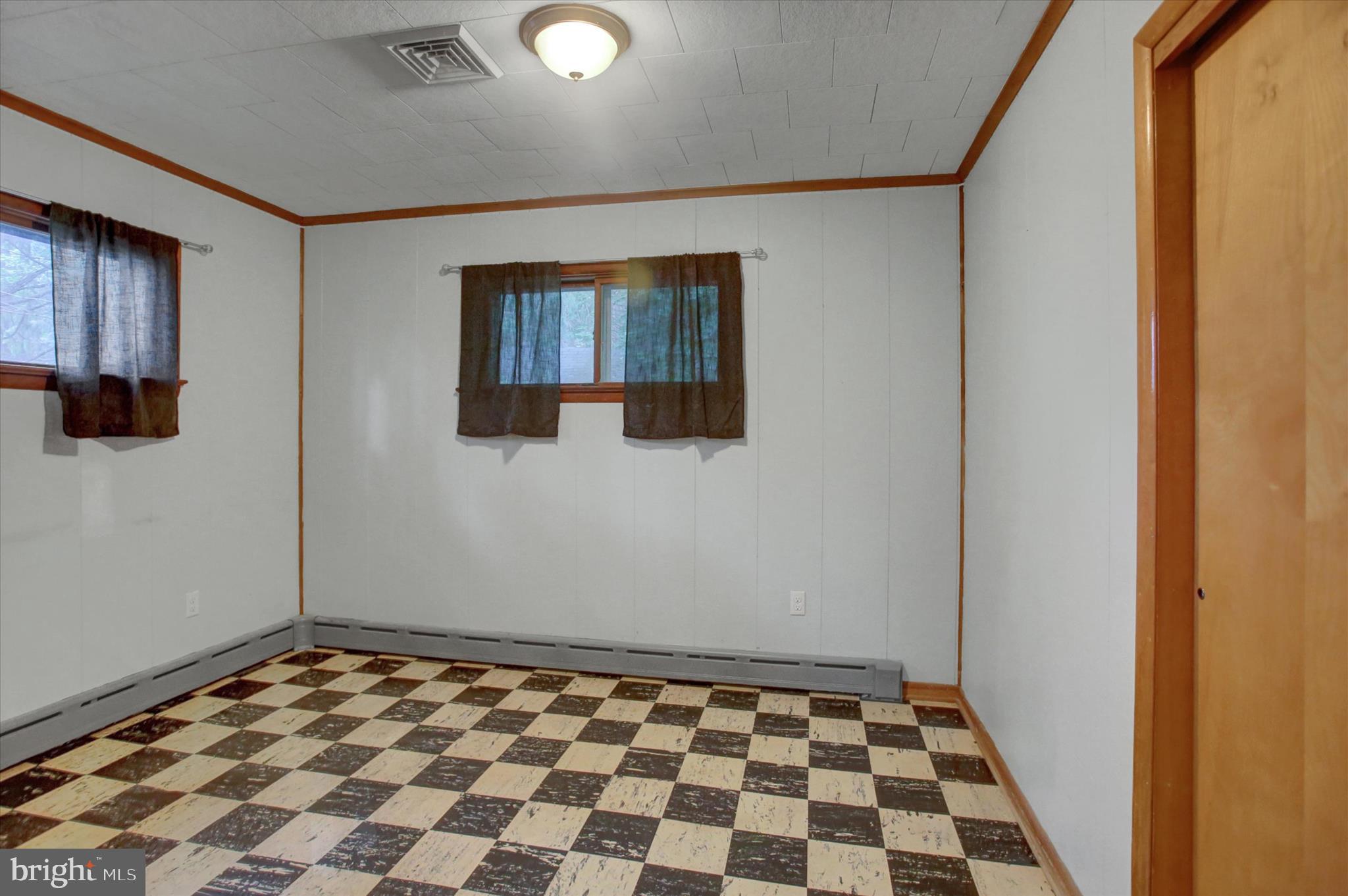 5156 Peach Orchard Road McConnellsburg, PA 17233 - Photo 21 of 34 a view of a livingroom with wooden floor and a window