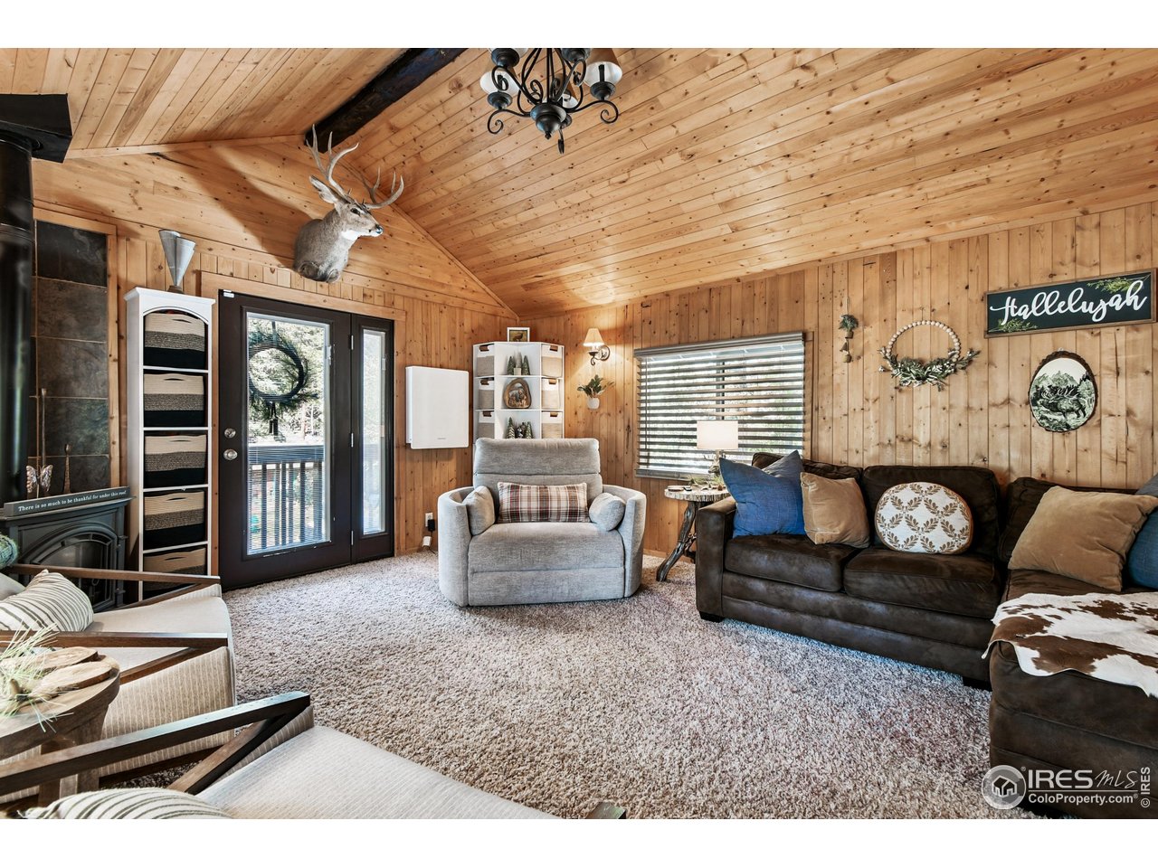 541 Riverside Drive Lyons, CO 80540 - Photo 10 of 45 Living room with door to front balcony