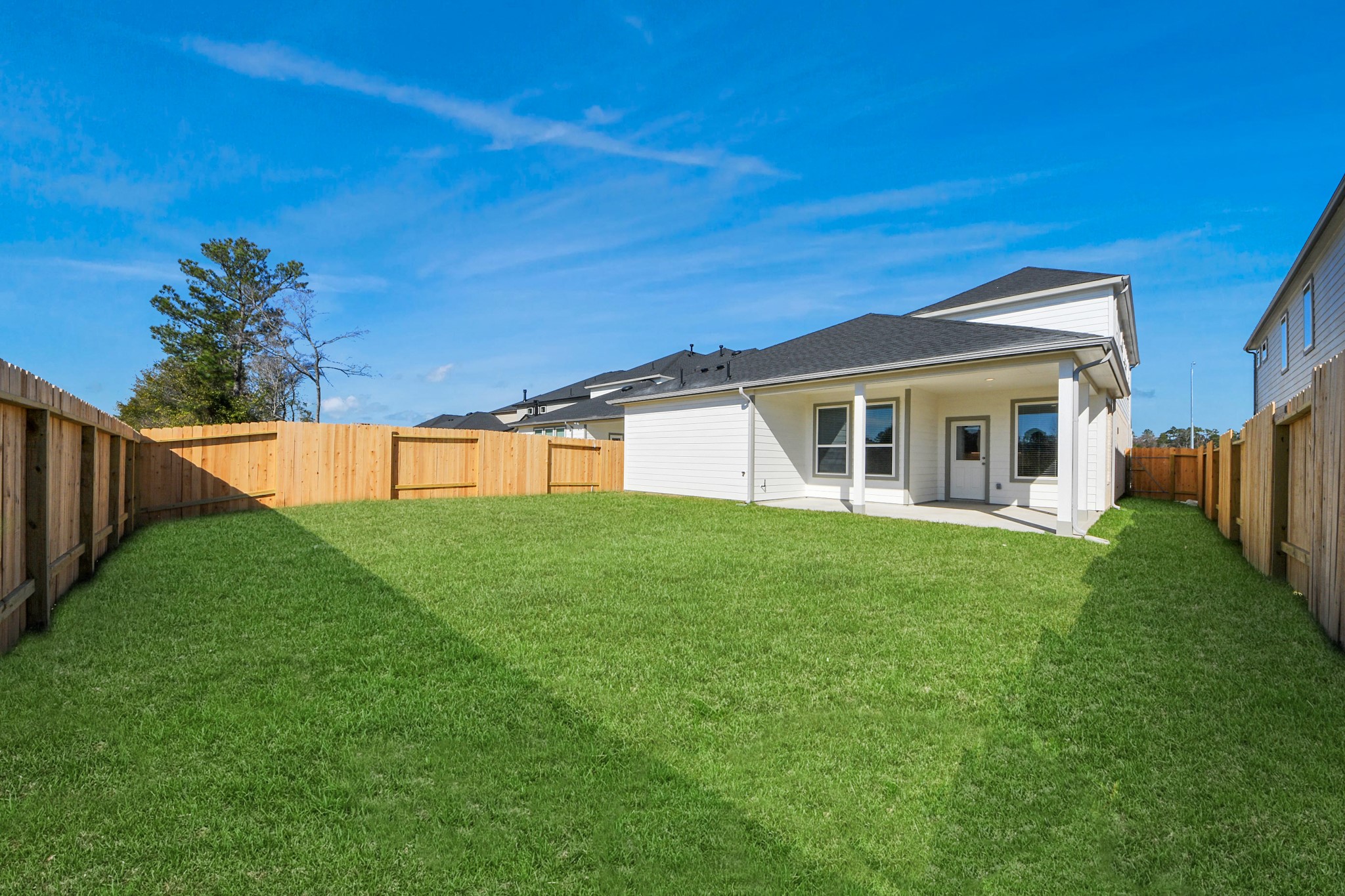 3002 Bury Park Dr Spring Spring, TX 77373 - Photo 43 of 45 Backyard retreat, offering an abundance of space for kids to play and explore. The possibilities are endless in this outdoor haven, where the joy of open-air activities and family gatherings awaits.