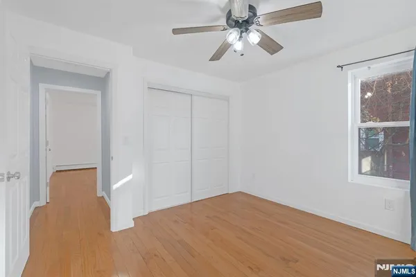 a view of a bedroom with closet
