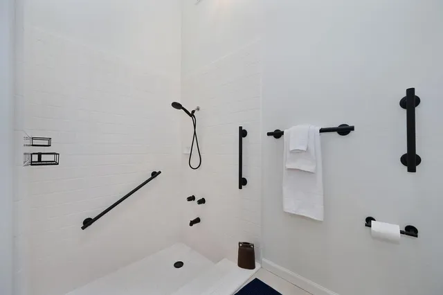 a view of a livingroom with workspace and a window