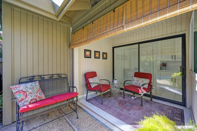 a view of a backyard with sitting area