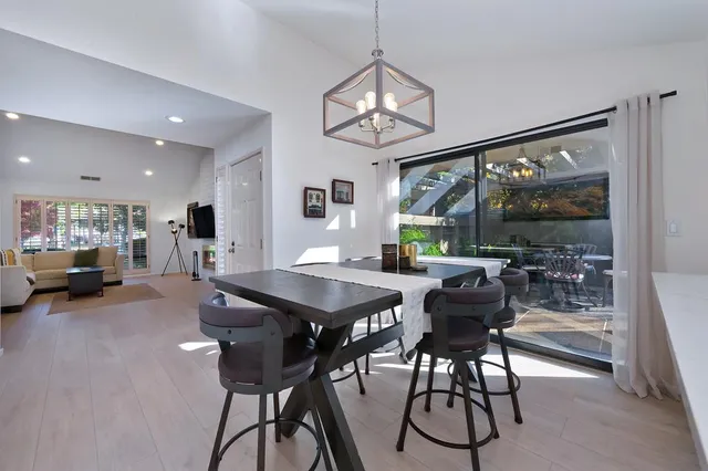 a view of a dining room with furniture window and outside view