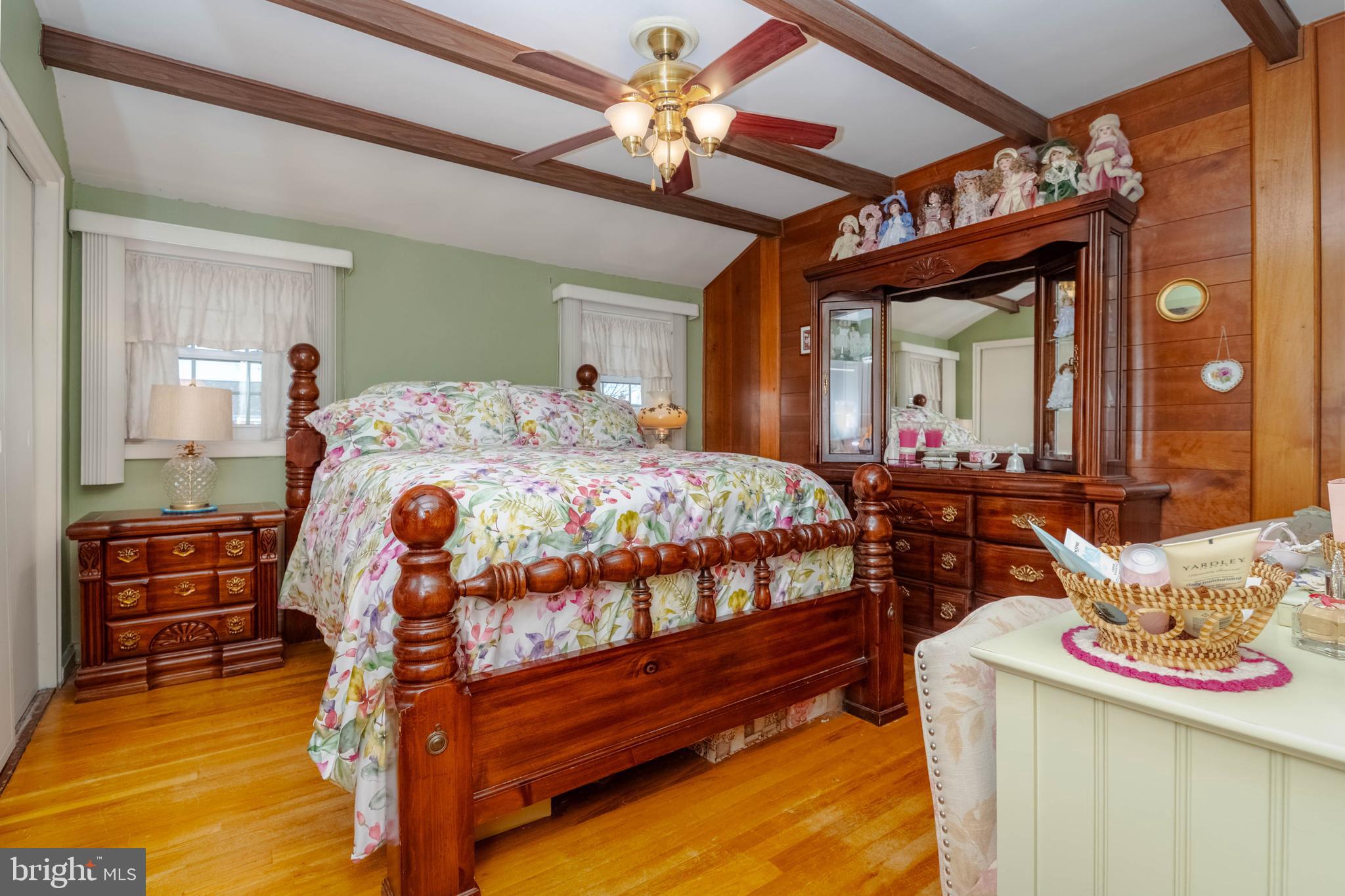 1930 Stanhope Road Baltimore, MD 21222 - Photo 14 of 32 a bedroom with a bed and a chandelier