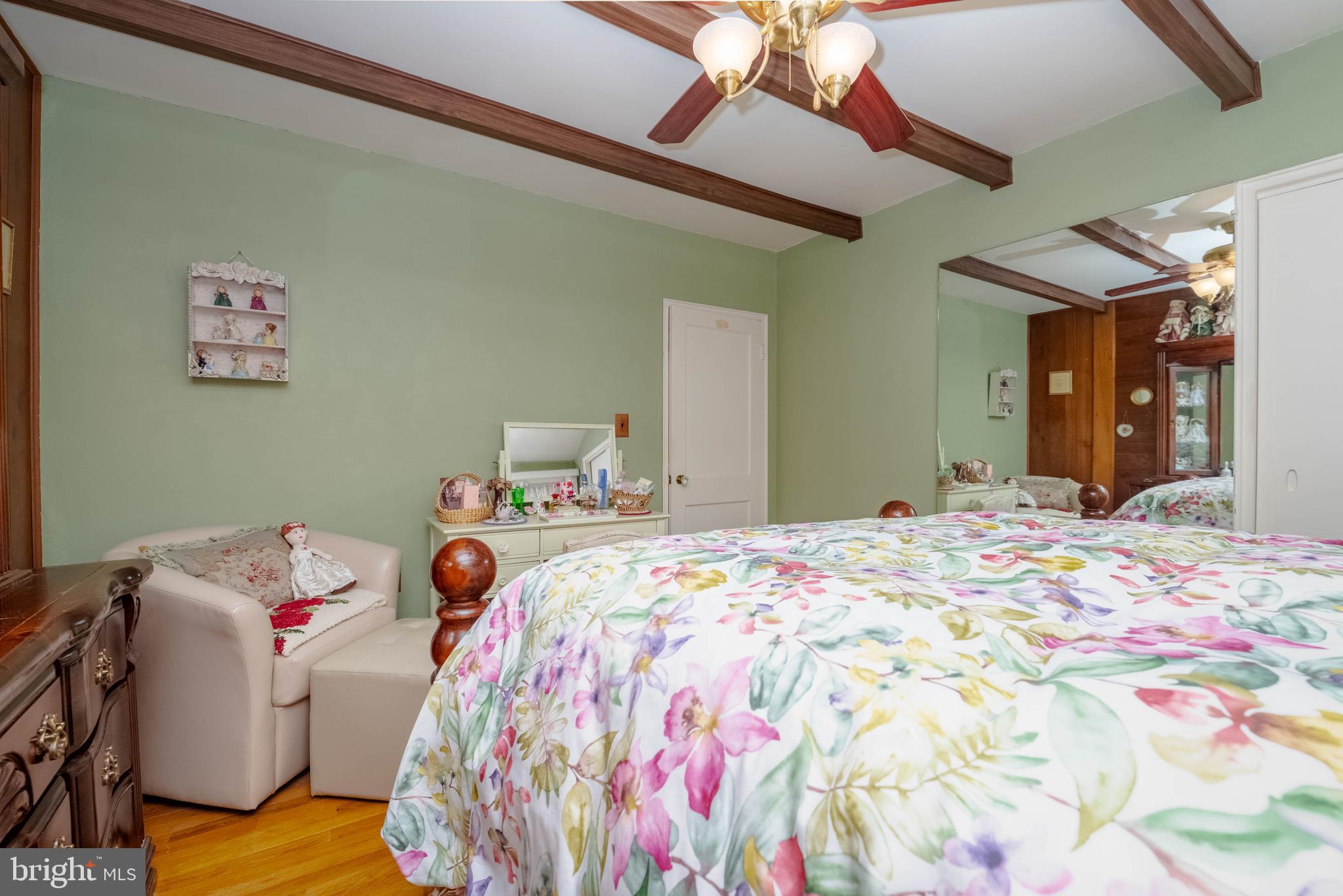 1930 Stanhope Road Baltimore, MD 21222 - Photo 16 of 32 a bedroom with a bed and a chandelier